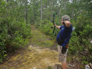 Man pulling back bow