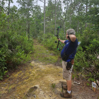 Man pulling back bow